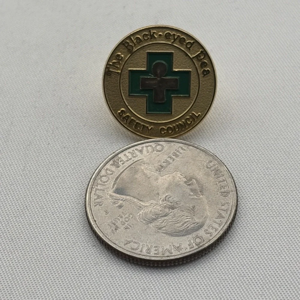 The Black-Eyed Pea Safety Council Green Cross Lapel Hat Pin